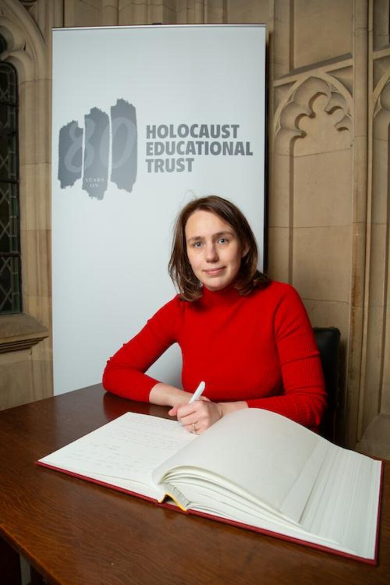 Elsie Blundell MP signing the Holocaust book of remembrance